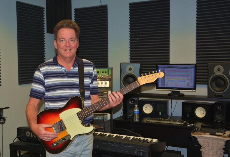 guitar instructor giving music lesson